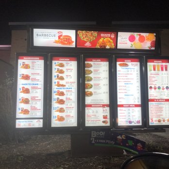 Wendy's - menus and prices on the side of a building - Burgers Near Me - Urbandale, Iowa