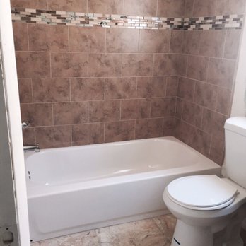 Xtreme Home Solutions - After brick pattern tile new tub. - Pressure Washers Near Me - Orlando, Florida