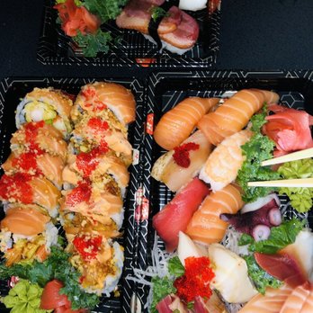 Sushi Blue - Top tray eel unagi nigiri with roasted duck nigiri below it. Left red dragon and salmon lover. Right sashimi/ nigiri combo - Japanese Near Me - Aurora, Ontario
