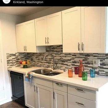 Multi Projects Repair - a kitchen with white cabinets - General Contractors Near Me