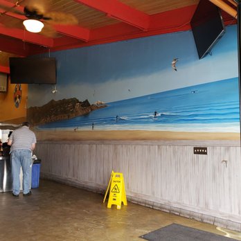 Burger-Board - a man and a woman at a counter - Hot Dogs Near Me - Pacifica, California Burger-Board - a man and a woman at a counter - Hot Dogs Near Me - Pacifica, California