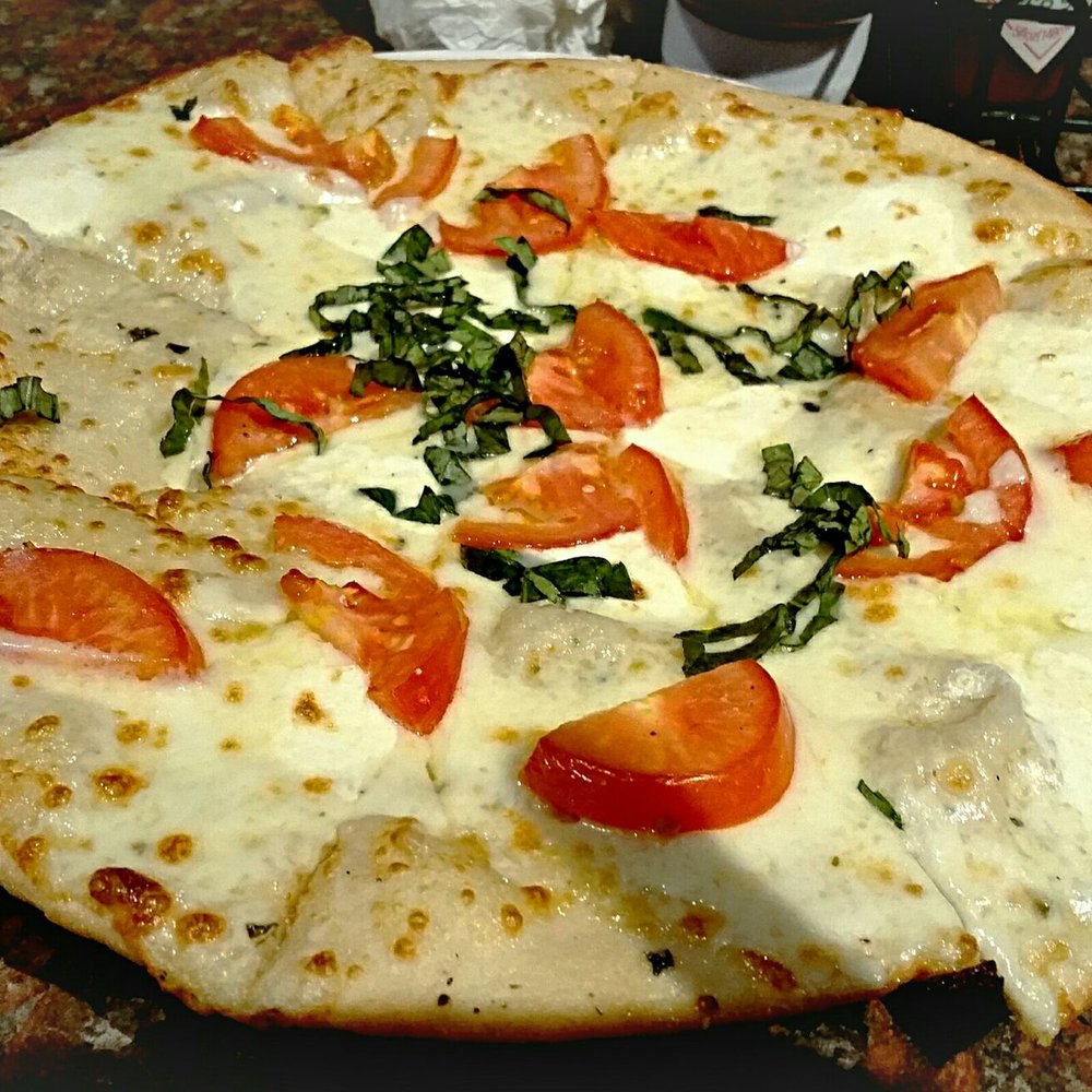 Mister Tramps - Margarita pizza, olive oil, fresh mozzarella, tomato, fresh basil - Sports Bars Near Me - Austin, Texas