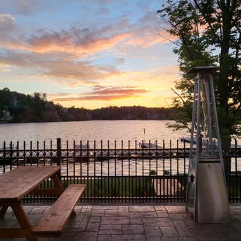 Boathouse Saranac Lake Pub - Outside patio, sunset over the water - Gastropubs Near Me - Saranac Lake, New York Boathouse Saranac Lake Pub - Outside patio, sunset over the water - Gastropubs Near Me - Saranac Lake, New York