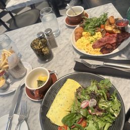 Loose green teas, wild Mushroom Omelet, French fries, scrambled eggs, turkey bacon, home fries and croissant.