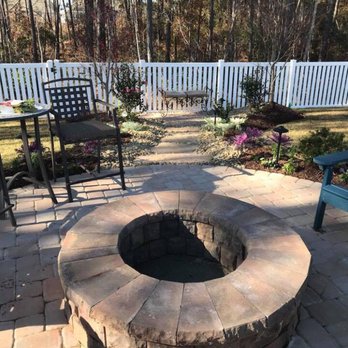 Seaside Scapes - a patio with a fire pit - Landscaping Near Me