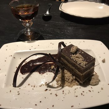 Heritage Tavern - Espresso Cake and amaro Montenegro in the background - New American Near Me - Madison, Wisconsin Heritage Tavern - Espresso Cake and amaro Montenegro in the background - New American Near Me - Madison, Wisconsin