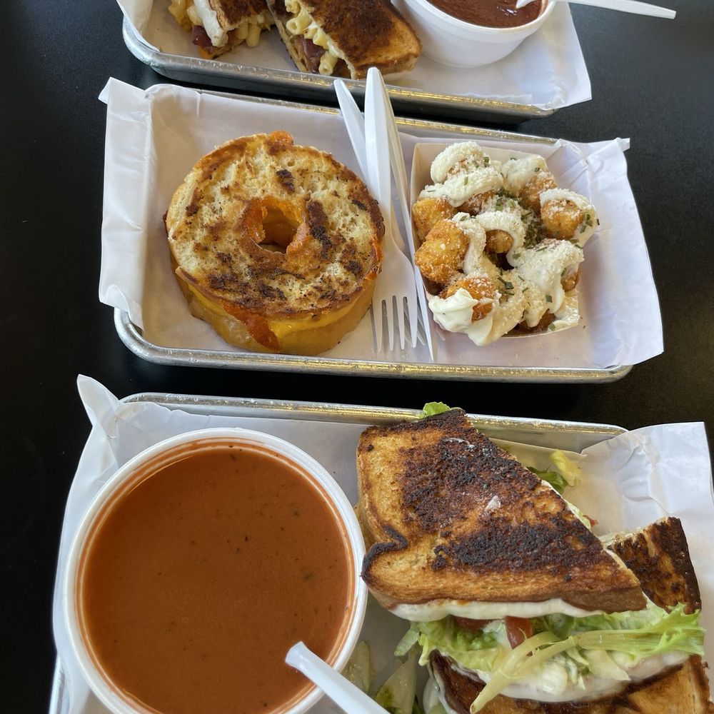 The Bacon Mac and Chee, Chicken Asiago, Garlic Cheese & Chive Tots, The Original Grilled Cheese Donut The Bacon Mac and Chee, Chicken Asiago, Garlic Cheese & Chive Tots, The Original Grilled Cheese Donut