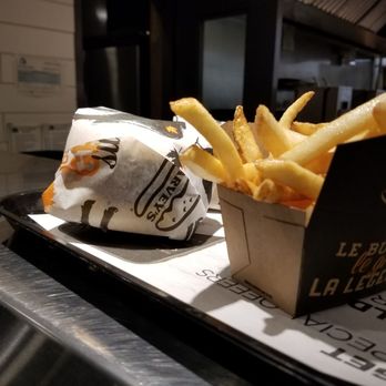 Harvey's - a tray of french fries on a counter - Burgers Near Me - Belleville, Ontario