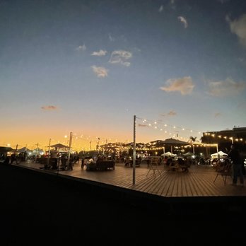 Ono Fresh Poke - people walking on a boardwalk at dusk - Poke Near Me - Honolulu, Hawaii Ono Fresh Poke - people walking on a boardwalk at dusk - Poke Near Me - Honolulu, Hawaii