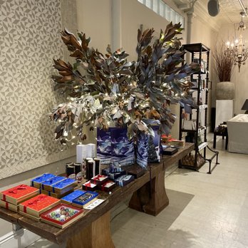 Cocoa Store - a table with books and a vase of flowers - Chocolatiers & Shops Near Me - New York, New York Cocoa Store - a table with books and a vase of flowers - Chocolatiers & Shops Near Me - New York, New York