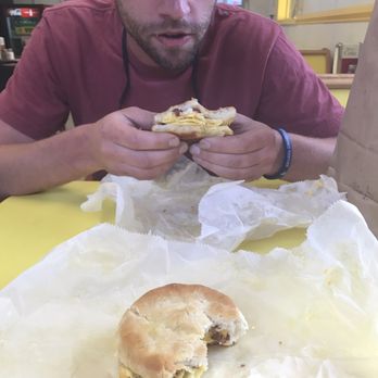 Danbury Grill - a man eating a sandwich - Pizza Near Me - Danbury, North Carolina