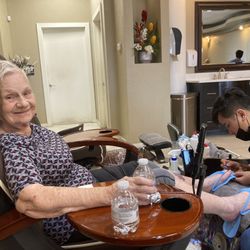 Merveilleux Nail Lounge & Spa - Relaxing while getting her mani pedi