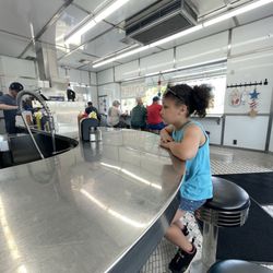 Bates Burgers - Main counter sitting area. You get to smell and see the fresh burgers being made!