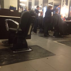 The Barber's Shop - Hair cutting in process.