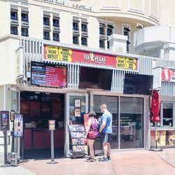 Tix4 - We are at the northwest corner of the Grand Bazaar Shoppes near the escalator and Bally's sign.
