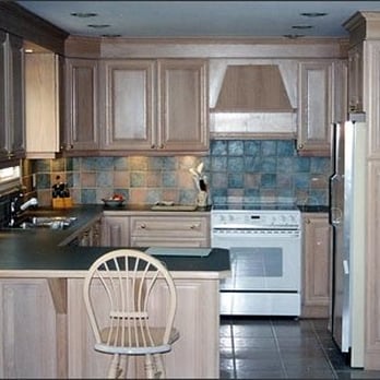 Steinbock Kitchens - a kitchen with wooden cabinets and white appliances - General Contractors Near Me - Pickering, Ontario Steinbock Kitchens - a kitchen with wooden cabinets and white appliances - General Contractors Near Me - Pickering, Ontario