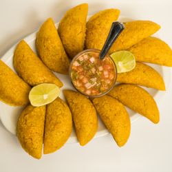 Dreams Restaurant - This is a Colombian snack made with corn and potatoes,wiht meat inside,very delicios.