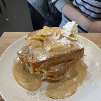 Egg 'N Smash - TALK TO THE POMME French toast with cinnamon caramelized apples, served with real whipped cream and a dusting of icing sugar and cinnamon. - Breakfast & Brunch Near Me - Pickering, Ontario Egg 'N Smash - TALK TO THE POMME French toast with cinnamon caramelized apples, served with real whipped cream and a dusting of icing sugar and cinnamon. - Breakfast & Brunch Near Me - Pickering, Ontario