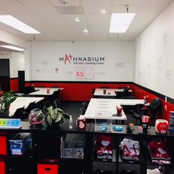 Mathnasium - Our uplifting, positive environment makes learning math fun! Students sit with instructors at our seating pods.