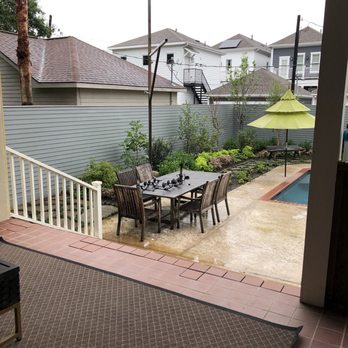 Strong Landscaping - a patio with a table and chairs - Landscaping Near Me - Houston, Texas Strong Landscaping - a patio with a table and chairs - Landscaping Near Me - Houston, Texas