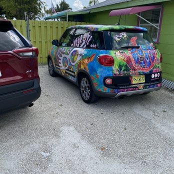Lovegrove Gallery & Gardens - Their cute car - Tours Near Me - Matlacha, Florida Lovegrove Gallery & Gardens - Their cute car - Tours Near Me - Matlacha, Florida