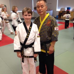 Hwang's Martial Arts - The new black belt with Grand Master Hwang