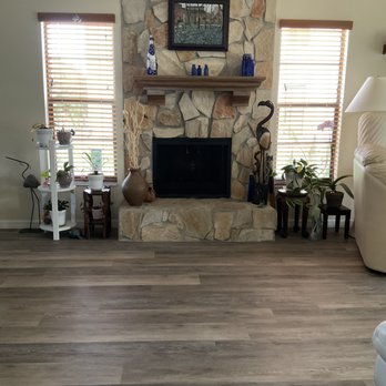 Giovanni's Flooring - Beautiful laminate flooring. Laid in beautifully at the fireplace. The floor color really blends in with the hearth. - Flooring Near Me - Trinity, Florida