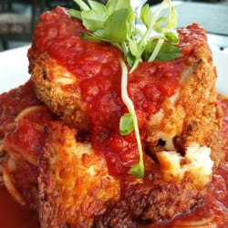 La Piazza Allegra - Breaded chicken scallopini rolled w/ mozzarella & Parmigiano Reggiano w/ a tomato sauce, over linguine in a fresh basil tomato sauce