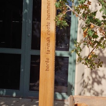Cafe Ohlone - a wooden pole with a sign on it - Specialty Food Near Me