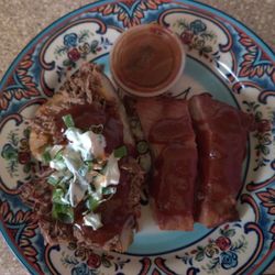 Bubba’s BBQ Pit - Half a Chopped Brisket Baked Potato and Couple of  St Louis Ribs.