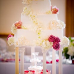 Vienna Florist And Gifts - We pleasantly surprised when the florist went out of her way to add flowers to our wedding cake for more color.