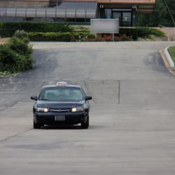 Naperville Taxi - Naperville Taxi # 007 entering a commercial Parking Lot