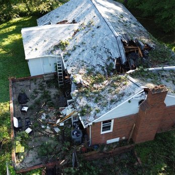 Kinum Tree & Stump - View of house and damage from outside. - Tree Services Near Me