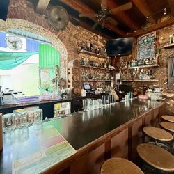 Greengos Caribbean Cantina - Indoor bar area with walk up open window for outside bar service.