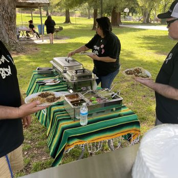 Taquizas Garcia - Rice, beans, and salsa bar. Taken from behind his serving grill. - Tacos Near Me Taquizas Garcia - Rice, beans, and salsa bar. Taken from behind his serving grill. - Tacos Near Me