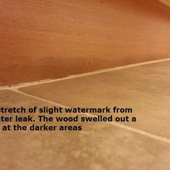 XLT Construction - Water damage already during installation! The wood swelled up a little in the darker area. - General Contractors Near Me - Scottsdale, Arizona XLT Construction - Water damage already during installation! The wood swelled up a little in the darker area. - General Contractors Near Me - Scottsdale, Arizona