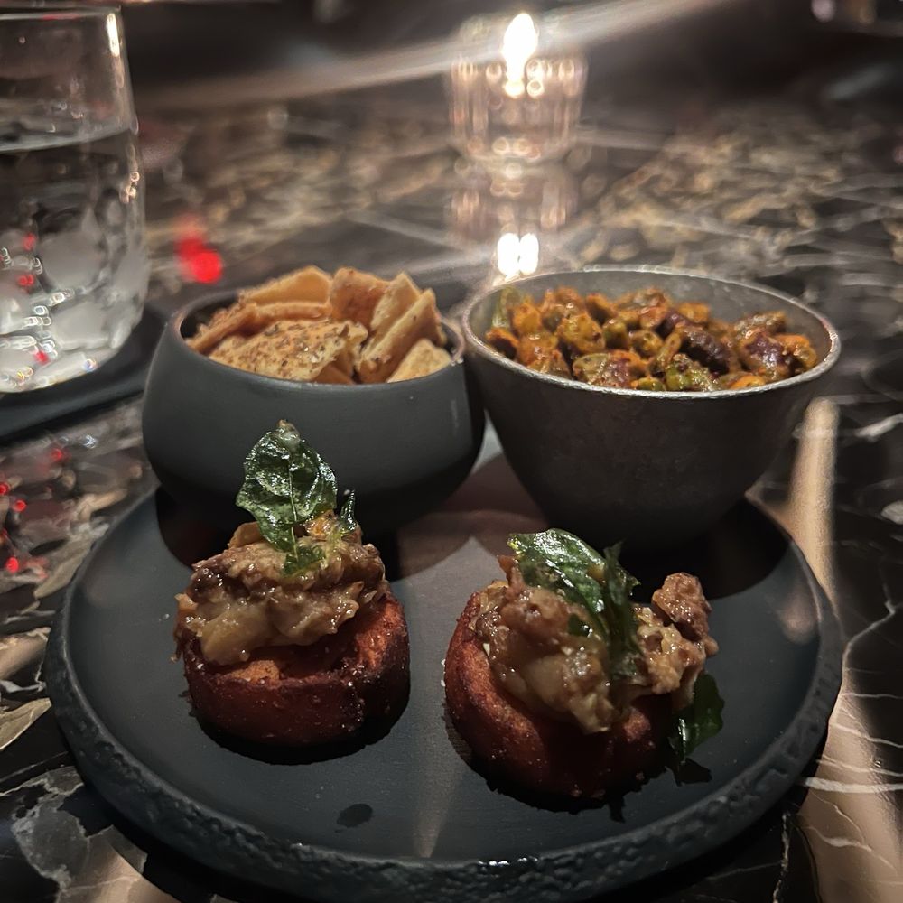 The Vault - House snacks of sweet potato gnocchi, crackers and pistachios - Speakeasies Near Me - Las Vegas, Nevada The Vault - House snacks of sweet potato gnocchi, crackers and pistachios - Speakeasies Near Me - Las Vegas, Nevada