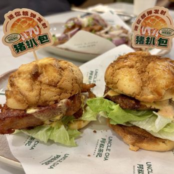 Uncle Cha Fusion Cafe - Bolo bao with pork chop (R) and chicken cutlet (L) - Asian Fusion Near Me - Milpitas, California Uncle Cha Fusion Cafe - Bolo bao with pork chop (R) and chicken cutlet (L) - Asian Fusion Near Me - Milpitas, California