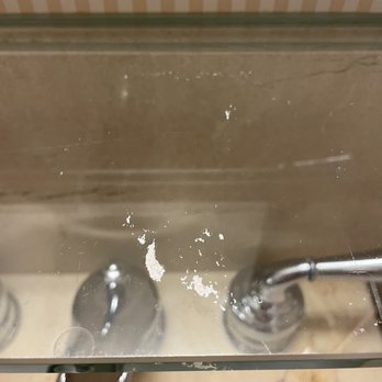 Hilton Milwaukee - Who knows what is stuck on this sink glass - Hotels Near Me - Milwaukee, Wisconsin