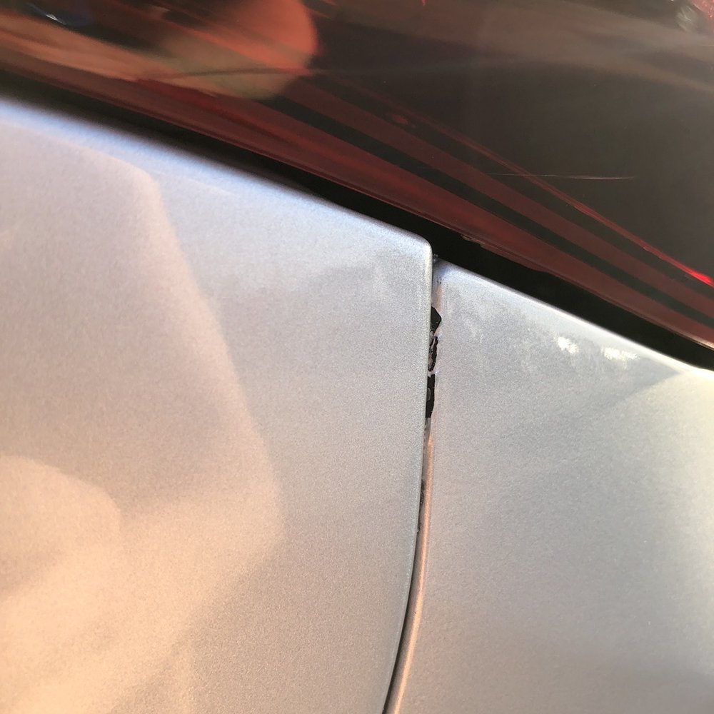 Eddie Dimeglio's Collision Experts - Paint chip on bumper at rear quarter panel - Body Shops Near Me - Davie, Florida