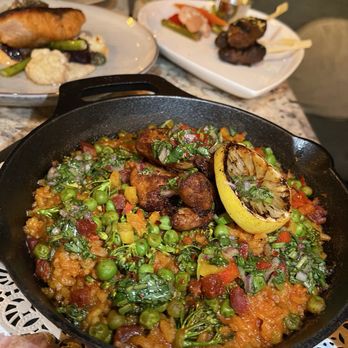 Cafe Americana - Jerk chicken paella - Tapas/Small Plates Near Me - Arlington, Texas Cafe Americana - Jerk chicken paella - Tapas/Small Plates Near Me - Arlington, Texas