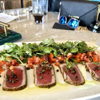 Proper Restaurant & Bar - MEDITERRANEAN YELLOWFIN TUNA -Seared and topped with capers, Spanish olives, and drizzled with 30a Olive Oil Meyer Lemon Oil - Beer Bar Near Me - Inlet Beach, Florida Proper Restaurant & Bar - MEDITERRANEAN YELLOWFIN TUNA -Seared and topped with capers, Spanish olives, and drizzled with 30a Olive Oil Meyer Lemon Oil - Beer Bar Near Me - Inlet Beach, Florida