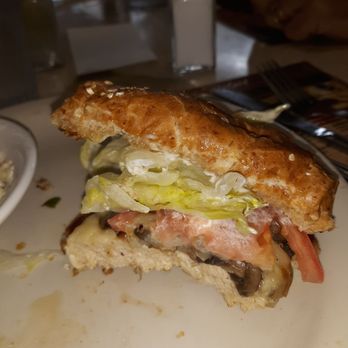 Breakfast Station - My smothered chicken sandwich cut in half. - Breakfast & Brunch Near Me - Beverly Hills, Florida