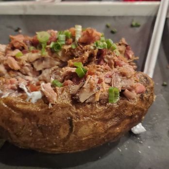 Johnson's Barbeque - Baked Potato Stuffed with the Works including BBQ Pork - Barbeque Near Me - Plant City, Florida Johnson's Barbeque - Baked Potato Stuffed with the Works including BBQ Pork - Barbeque Near Me - Plant City, Florida