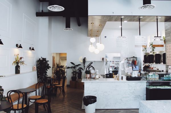 Photo of THÉ MOON Tea House - Calgary, AB, CA. Front counter + additional seating