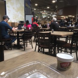 people sitting at tables in a restaurant people sitting at tables in a restaurant