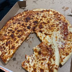 Little Caesars - A pizza with a large bite taken from it