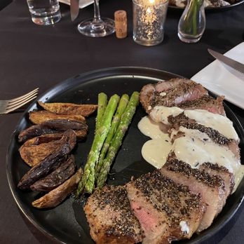 The Vineyard - New York strip steak with cognac cream sauce and roasted asparagus and potatoes - Wine Bars Near Me - Havre de Grace, Maryland The Vineyard - New York strip steak with cognac cream sauce and roasted asparagus and potatoes - Wine Bars Near Me - Havre de Grace, Maryland