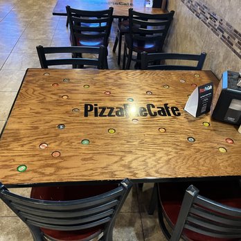 Pizza Pie Café - a wooden table and chairs - Pizza Near Me - Twin Falls, Idaho Pizza Pie Café - a wooden table and chairs - Pizza Near Me - Twin Falls, Idaho