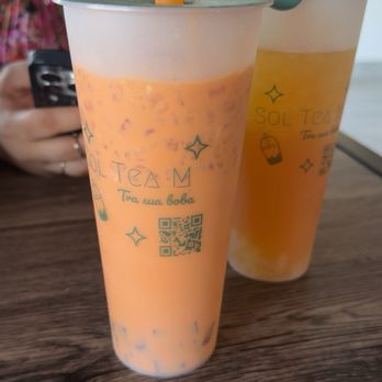 Sol Tea M - Thai tea and passionfruit tea with lychee jelly (back) - Coffee & Tea Near Me - Woodbridge, Virginia Sol Tea M - Thai tea and passionfruit tea with lychee jelly (back) - Coffee & Tea Near Me - Woodbridge, Virginia